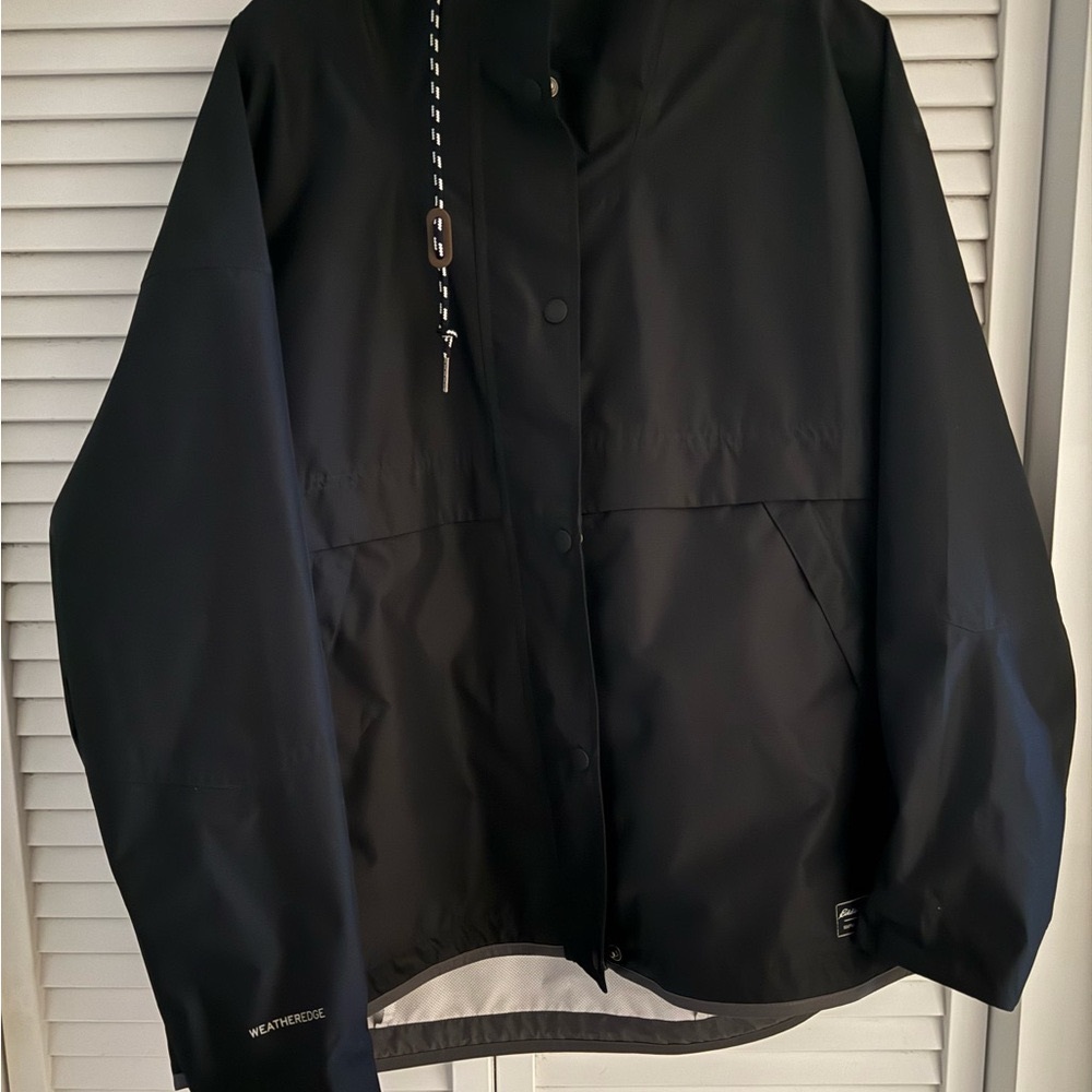 Eddie Bauer Black Jacket/Raincoat with hood. Zipper and Snap closure.